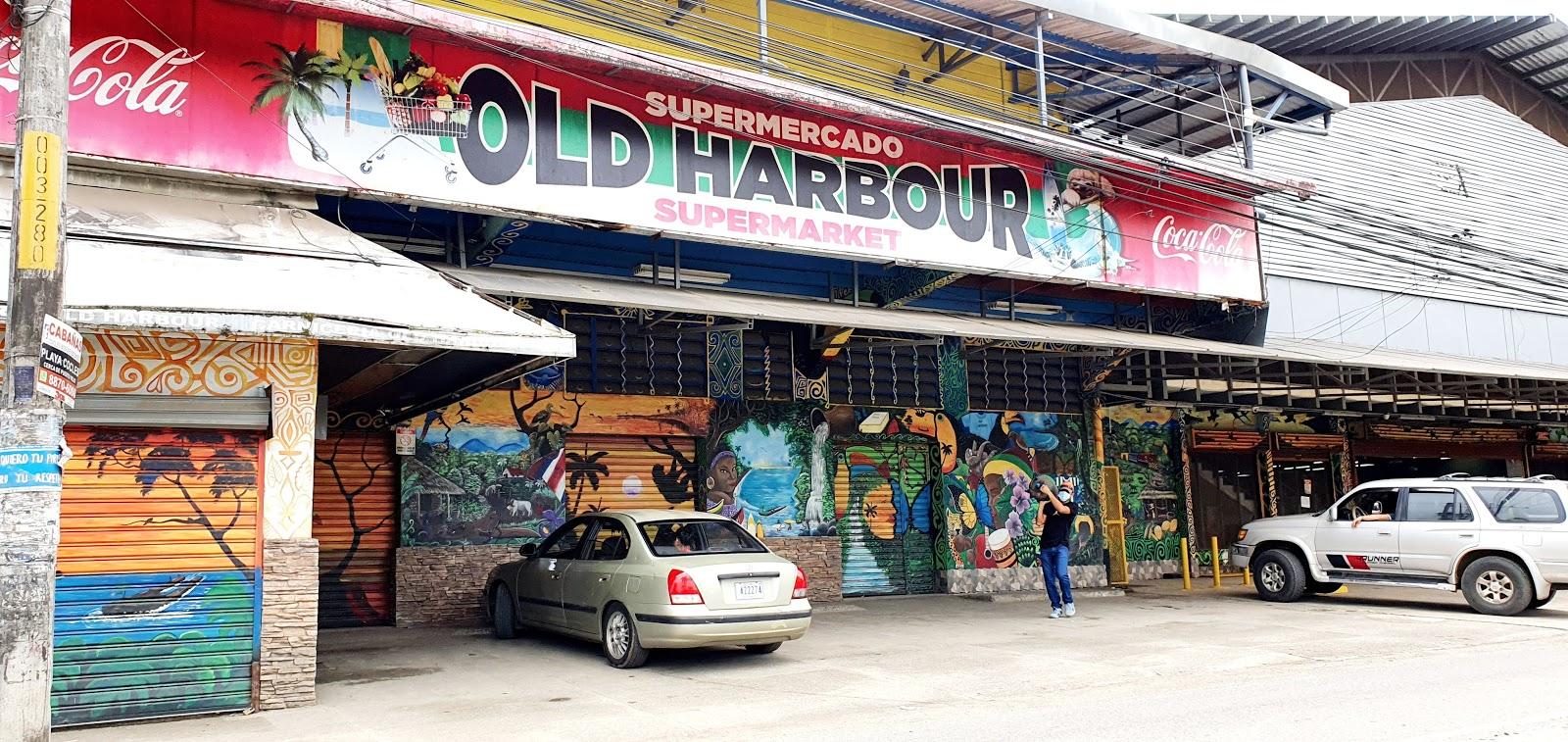 Supermercado Old Harbour storefront and mural